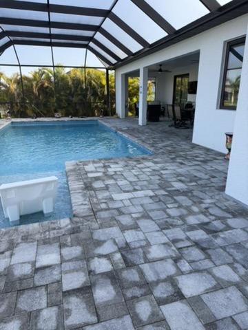 Pool area with covered patio visible behind