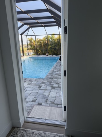 View through sliding door to pool