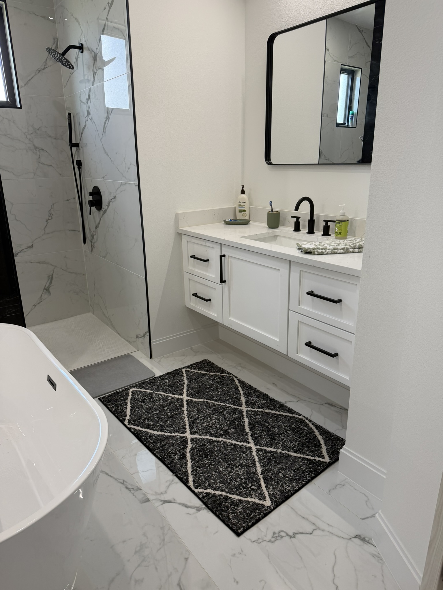 Luxury master bathroom with freestanding soaking tub