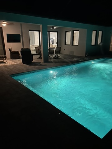 Pool lit up at night